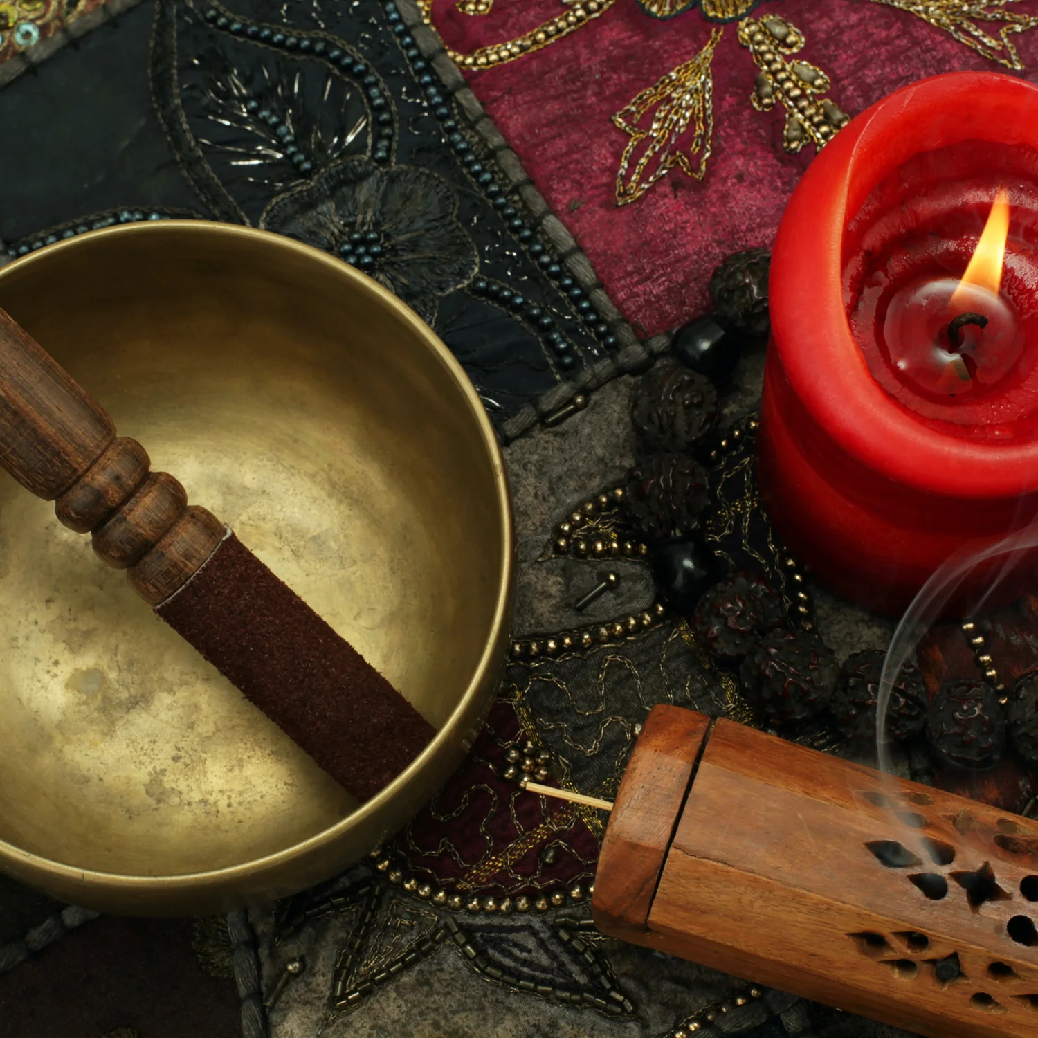 Singing bowl, candle, and incense