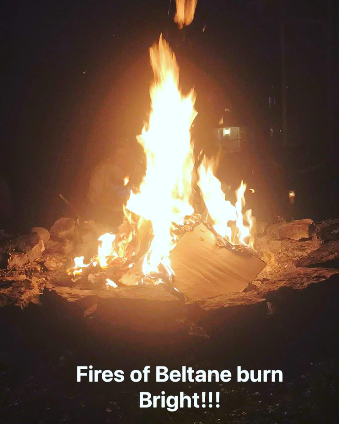A ceremonial fire burning at night