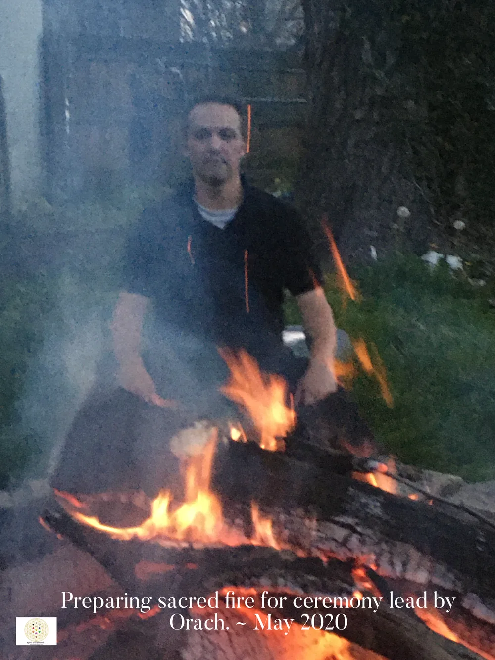 Orach preparing sacred fire for ceremony